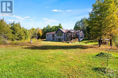 view of the back lawn toward the house - 1608 Nolans Road, Montague, ON - Outdoor