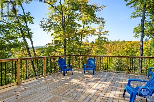 Expansive deck overlooks picturesque landscape - 1074 Barrett Chute Road, Calabogie, ON - Outdoor With Deck Patio Veranda