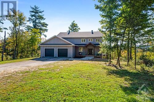 Oversized attached double garage with door to yard - 1074 Barrett Chute Road, Calabogie, ON - Outdoor