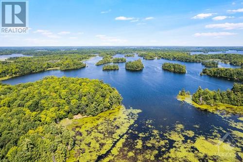 Home has 700' on Benson Lake where you can boat to Rideauy Canal - 161 A Taggart Lane, Westport, ON - Outdoor With Body Of Water With View