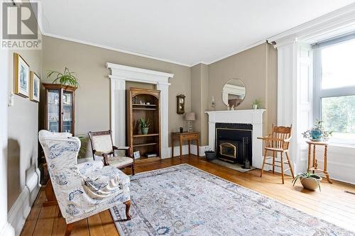 Living fireplace with Napoleon woodstove insert - 2931 Drummond Concession 7 Road, Perth, ON - Indoor Photo Showing Living Room With Fireplace