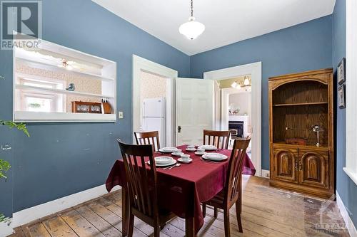 Formal dining room with pass through window and also window overlooking countryside - 2931 Drummond Concession 7 Road, Perth, ON - Indoor Photo Showing Dining Room