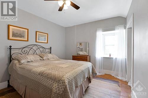 Second floor primary bedroom with full length closet and pine floor - 2931 Drummond Concession 7 Road, Perth, ON 