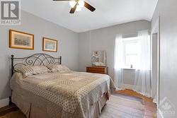 Second floor primary bedroom with full length closet and pine floor - 