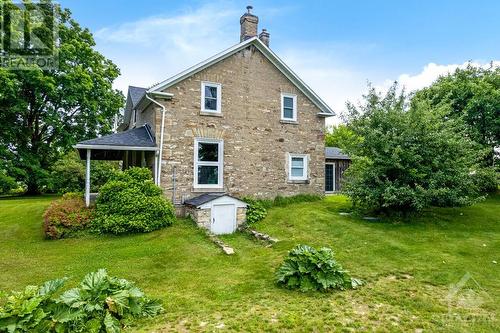 Side view of home, with outside access to basement - 2931 Drummond Concession 7 Road, Perth, ON 