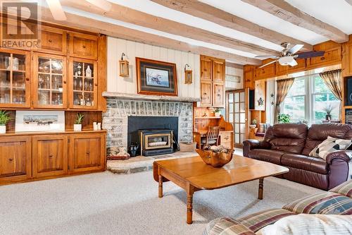 Living room wood-burning stone fireplace - 3581 Drummond Concession 2 Road, Perth, ON 