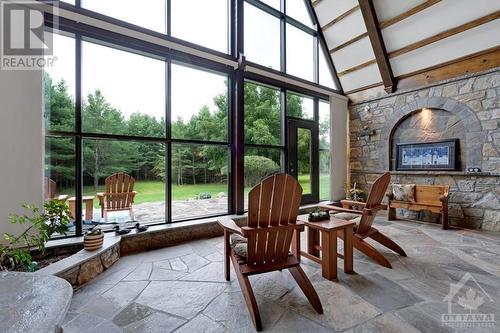 Solarium's view of serenity - 2499 Bathurst Concession 2 Road, Perth, ON - Indoor With Fireplace