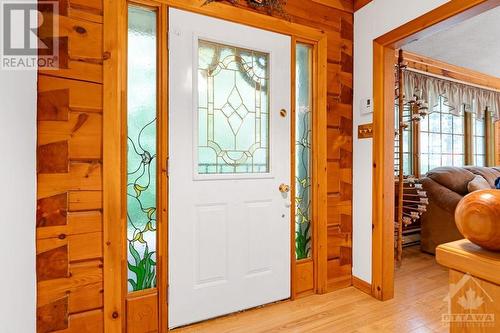 Bright welcoming foyer; front door has hand-crafted, stained glass panels - 1102 Ebbs Bay Road, Carleton Place, ON - Indoor Photo Showing Other Room