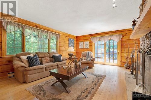 Large windows with views of green, quiet calm - 1102 Ebbs Bay Road, Carleton Place, ON - Indoor Photo Showing Living Room