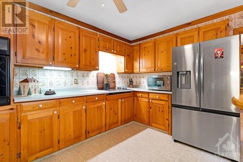 Spacious sunny kitchen has large refrigerator with water&ice dispenser and extra prep areas - 1102 Ebbs Bay Road, Carleton Place, ON - Indoor Photo Showing Kitchen