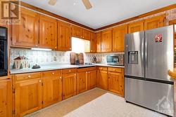 Spacious sunny kitchen has large refrigerator with water&ice dispenser and extra prep areas - 