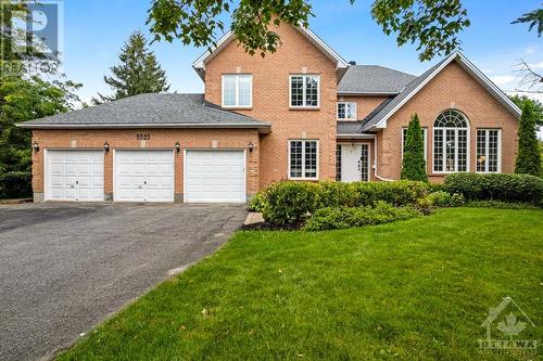 Stately, eye-catching, all-brick family home - 5525 Pettapiece Crescent, Manotick, ON - Outdoor With Facade