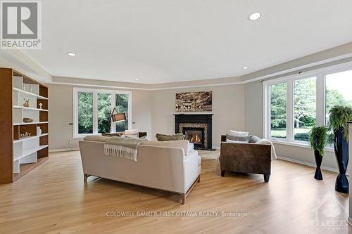 5525 Pettapiece Crescent, Ottawa, ON - Indoor Photo Showing Living Room With Fireplace