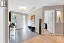 White bright foyer has closet and new 2024 ceramic flooring - 5525 Pettapiece Crescent, Manotick, ON  - Indoor Photo Showing Other Room 