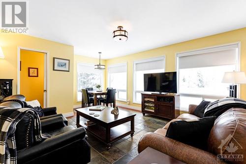 Familyroom slate floor, dinette and windows with spectacular country view - plus custom black-out blinds - 2344 Mclachlin Road, Beckwith (910 - Beckwith Twp), ON - Indoor Photo Showing Living Room