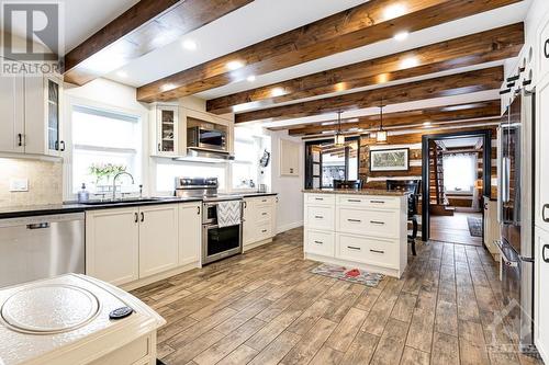 Custom gourmet kitchen with 1" thick granite counters and island plus, porcelain floor - 2344 Mclachlin Road, Beckwith (910 - Beckwith Twp), ON - Indoor Photo Showing Kitchen