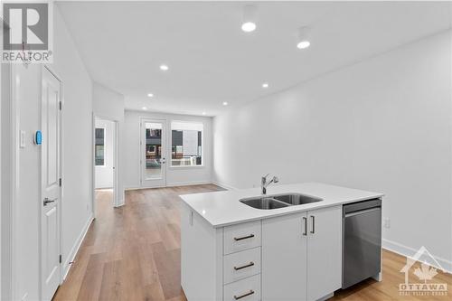 655 Wanaki Road Unit#207, Ottawa, ON - Indoor Photo Showing Kitchen With Double Sink