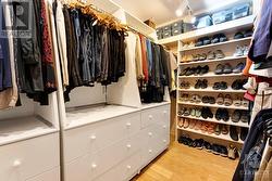 Primary bedroom walk-in closet - 