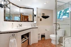 Main floor sparkling white bathroom with glass shower - 