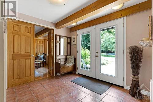 Home's grand front foyer has closet and terracotta ceramic floor flowing into open living spaces - 150 Dewolfe Street, Ottawa, ON - Indoor Photo Showing Other Room