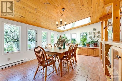 All windowed dining room with magnificent river views - 150 Dewolfe Street, Ottawa, ON - Indoor Photo Showing Dining Room