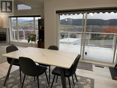 7116 Lakeridge Drive, Vernon, BC - Indoor Photo Showing Dining Room With Fireplace