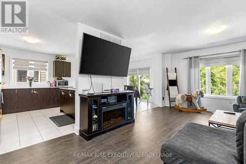 58 Brennan Crescent, Loyalist, ON - Indoor Photo Showing Living Room With Fireplace