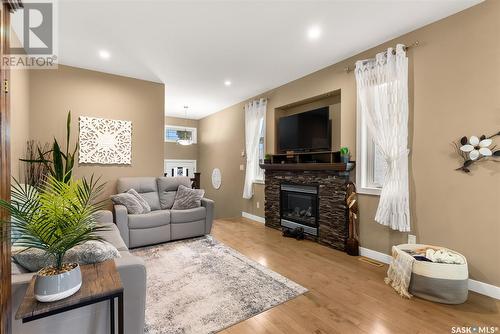 4209 Green Olive Way E, Regina, SK - Indoor Photo Showing Living Room With Fireplace