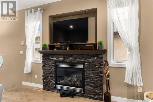 4209 Green Olive Way E, Regina, SK - Indoor Photo Showing Living Room With Fireplace