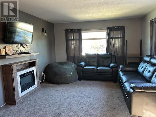 103 6100 Dakelh Ti, Prince George, BC - Indoor Photo Showing Living Room With Fireplace