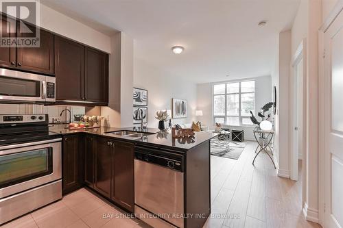 117 - 10 Bloorview Place, Toronto, ON - Indoor Photo Showing Kitchen With Double Sink