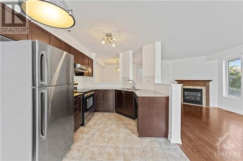 298 Macoun Circle, Hunt Club - South Keys And Area (3806 - Hunt Club Park/Greenboro), ON - Indoor Photo Showing Kitchen With Fireplace