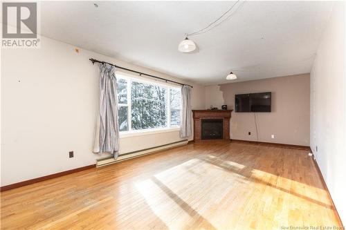 57 Communication Road, Irishtown, NB - Indoor Photo Showing Living Room With Fireplace