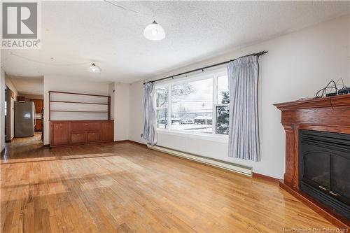 57 Communication Road, Irishtown, NB - Indoor Photo Showing Other Room With Fireplace