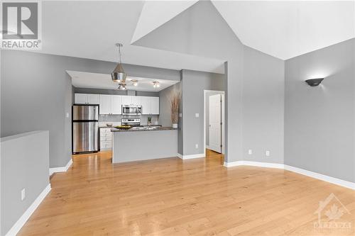 Main living space into kitchen. - 231 Crestway Drive Unit#J, Ottawa, ON - Indoor Photo Showing Kitchen