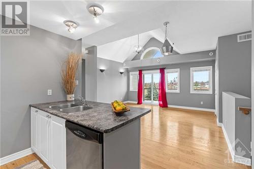 Kitchen breakfast bar. - 231 Crestway Drive Unit#J, Ottawa, ON - Indoor Photo Showing Kitchen With Double Sink