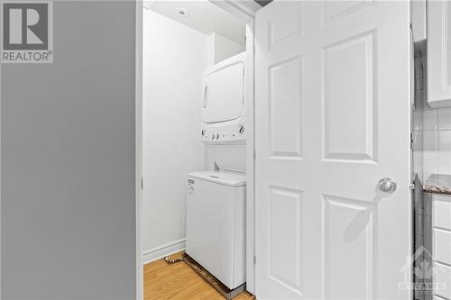 Stacked laundry & Front Closet space for coats, shoes and storage items. - 231 Crestway Drive Unit#J, Ottawa, ON - Indoor Photo Showing Laundry Room