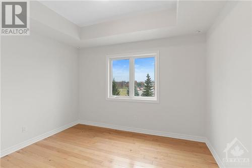 2nd bedroom w/ large window. - 231 Crestway Drive Unit#J, Ottawa, ON - Indoor Photo Showing Other Room