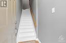 Front foyer entrance with freshly painted stairs up to the main level. - 231 Crestway Drive Unit#J, Ottawa, ON  - Indoor Photo Showing Other Room 