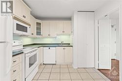 Tiled kitchen w/ tons of storage space and white appliances! - 