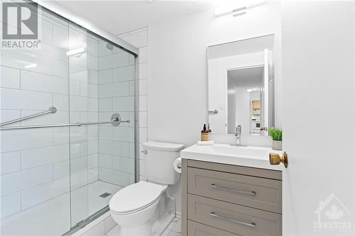 Fully renovated 3 piece bathroom w/ glass enclosed shower and modern vanity. - 1285 Cahill Drive Unit#507, Ottawa, ON - Indoor Photo Showing Bathroom