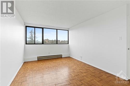 Primary bedroom w/ expansive windows facing South. - 1285 Cahill Drive Unit#507, Ottawa, ON - Indoor Photo Showing Other Room