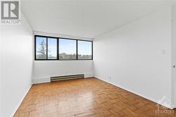 Primary bedroom w/ expansive windows facing South. - 