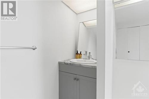 Modern vanity and private toilet. - 1285 Cahill Drive Unit#507, Ottawa, ON - Indoor Photo Showing Bathroom