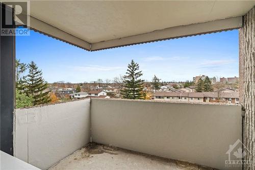 Walkout balcony facing South w/ view of the outdoor pool and community. - 1285 Cahill Drive Unit#507, Ottawa, ON - Outdoor With Balcony