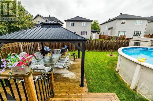 128 Olde Towne Avenue, Russell, ON - Outdoor With Above Ground Pool With Deck Patio Veranda With Backyard