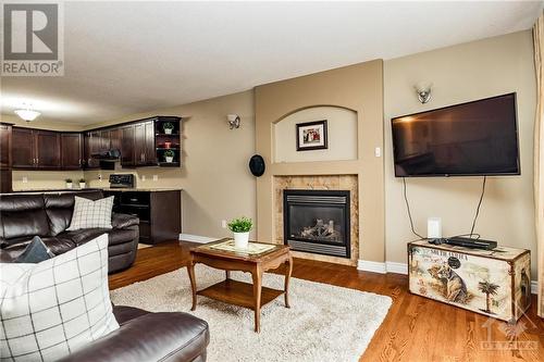 128 Olde Towne Avenue, Russell, ON - Indoor Photo Showing Living Room With Fireplace