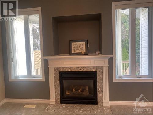 gas fireplace with indent for your TV - 60 Forest Creek Drive, Ottawa, ON - Indoor Photo Showing Living Room With Fireplace