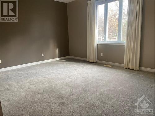 primary bedroom with new carpeting - 60 Forest Creek Drive, Ottawa, ON - Indoor Photo Showing Other Room