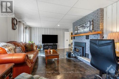 4225 Scotch Line, Tay Valley, ON - Indoor Photo Showing Living Room With Fireplace